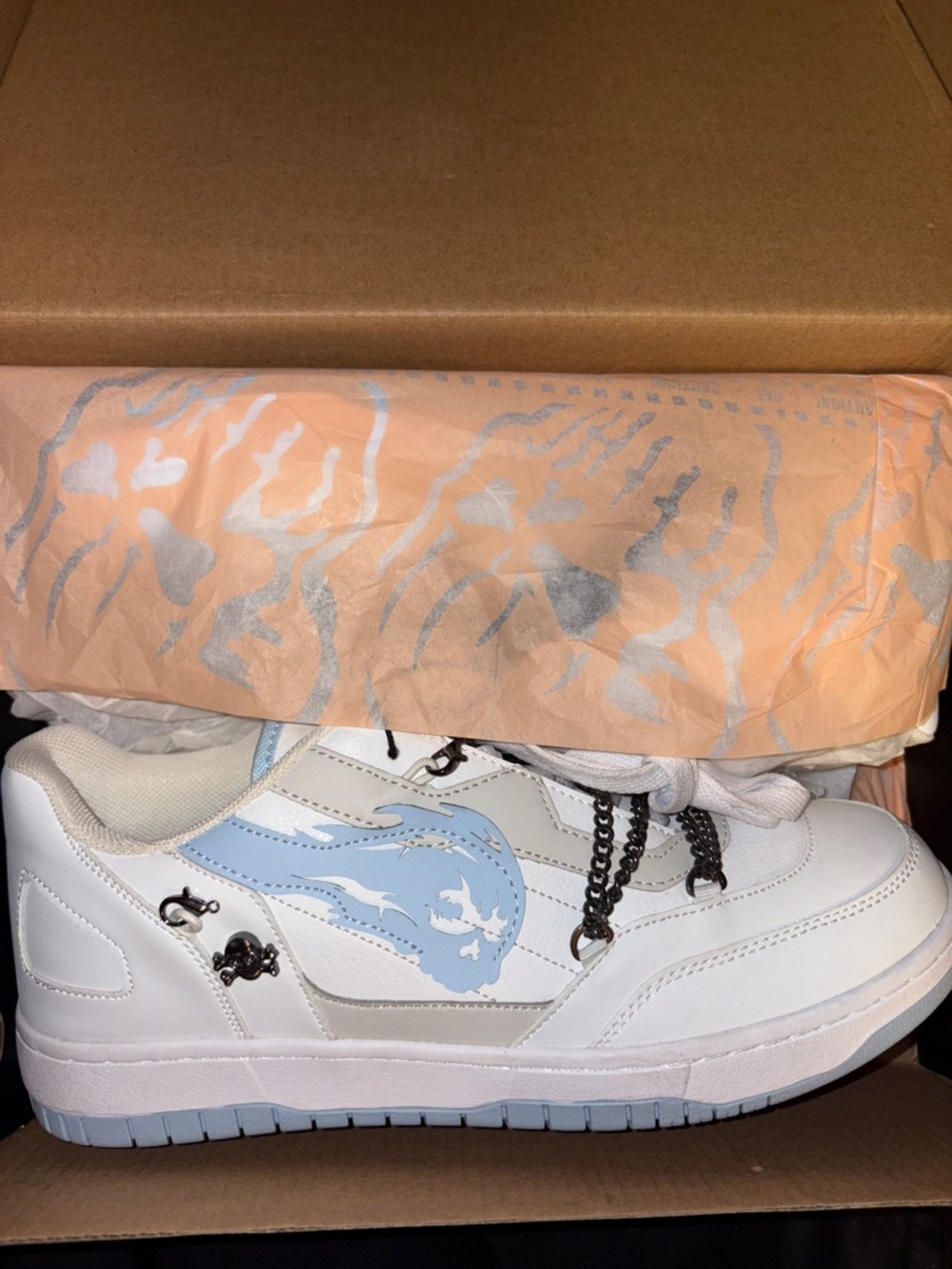 White Sneaker with Light Blue Flame Graphic
